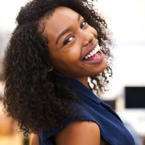 Smiling woman with curly hair